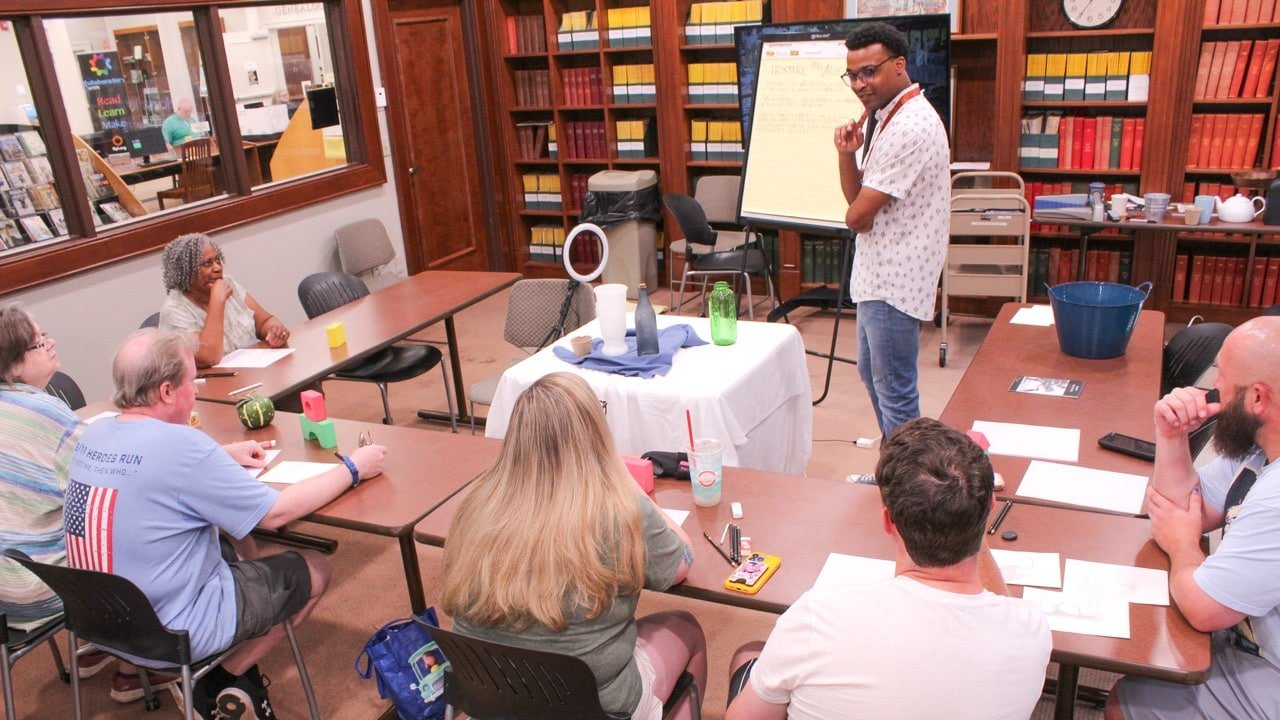 Photo of adults taking a drawing class at Florence-Lauderdale Public Library